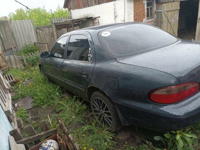 Синий Киа Кларус, объемом двигателя 2 л и пробегом 320 тыс. км за 900 $, фото 1 на Automoto.ua
