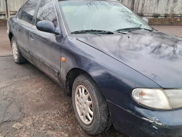 Синий Киа Кларус, объемом двигателя 2 л и пробегом 243 тыс. км за 1383 $, фото 1 на Automoto.ua