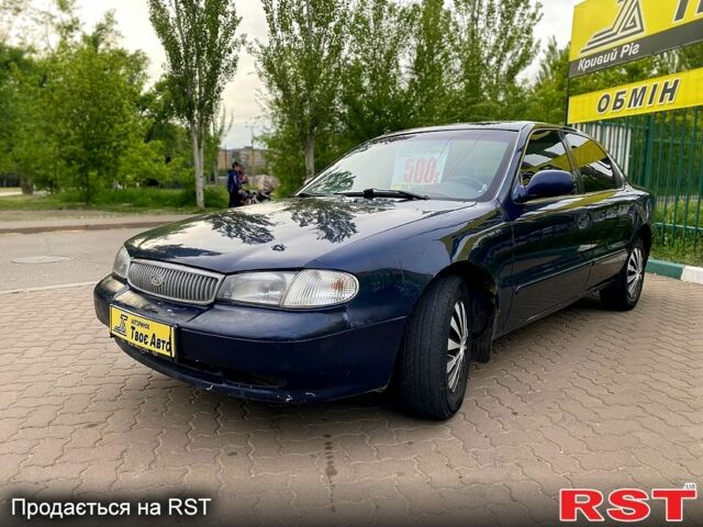 Синий Киа Кларус, объемом двигателя 2 л и пробегом 252 тыс. км за 1999 $, фото 1 на Automoto.ua
