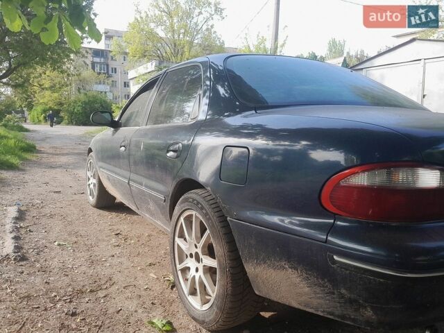Синій Кіа Кларус, об'ємом двигуна 2 л та пробігом 270 тис. км за 1200 $, фото 1 на Automoto.ua