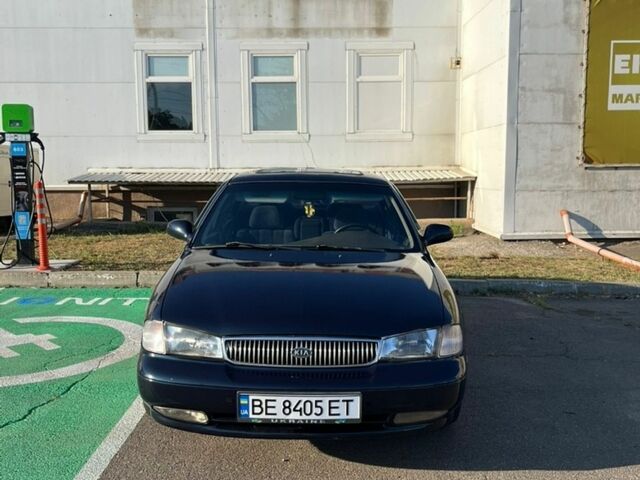 Синій Кіа Кларус, об'ємом двигуна 2 л та пробігом 285 тис. км за 2000 $, фото 1 на Automoto.ua
