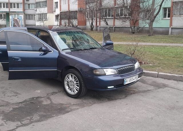 Синий Киа Кларус, объемом двигателя 2 л и пробегом 400 тыс. км за 2000 $, фото 1 на Automoto.ua