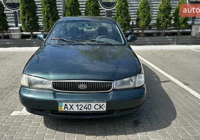 Зелений Кіа Кларус, об'ємом двигуна 2 л та пробігом 350 тис. км за 1999 $, фото 1 на Automoto.ua