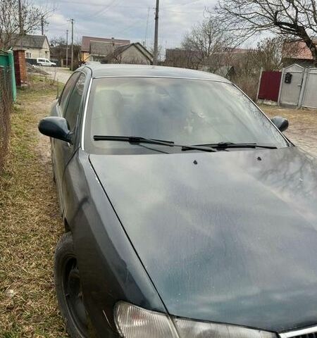 Зелений Кіа Кларус, об'ємом двигуна 2 л та пробігом 360 тис. км за 1100 $, фото 1 на Automoto.ua