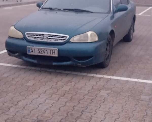 Зелений Кіа Кларус, об'ємом двигуна 2 л та пробігом 260 тис. км за 2000 $, фото 1 на Automoto.ua