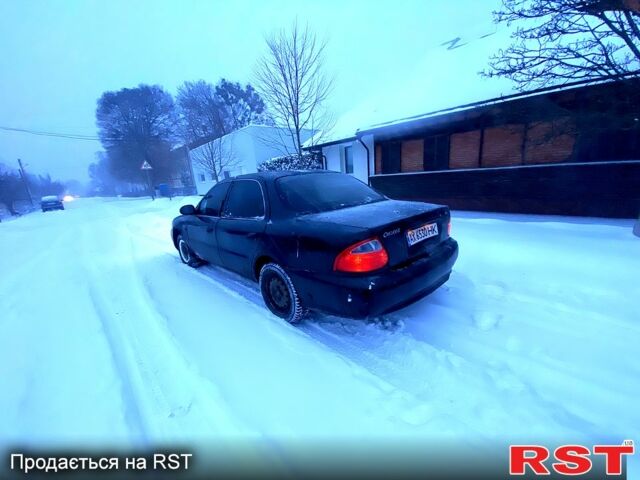 Зеленый Киа Кларус, объемом двигателя 1.8 л и пробегом 220 тыс. км за 850 $, фото 1 на Automoto.ua