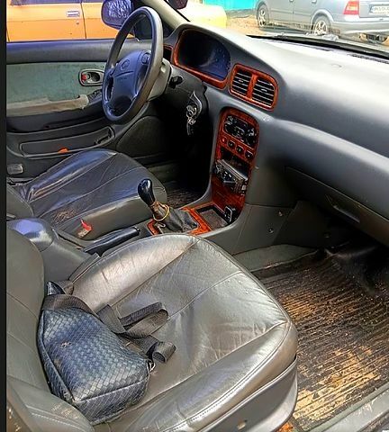 Оранжевый Киа Кларус, объемом двигателя 2 л и пробегом 0 тыс. км за 1350 $, фото 1 на Automoto.ua
