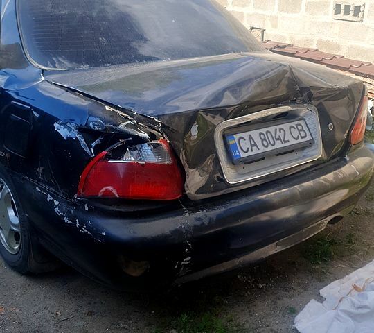 Чорний Кіа Кредос, об'ємом двигуна 2 л та пробігом 315 тис. км за 900 $, фото 1 на Automoto.ua