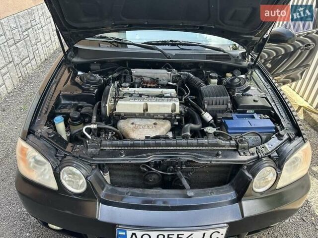 Черный Киа Маджентис, объемом двигателя 2 л и пробегом 460 тыс. км за 4500 $, фото 1 на Automoto.ua