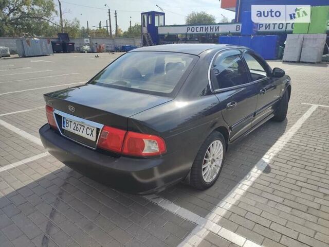 Черный Киа Маджентис, объемом двигателя 2 л и пробегом 245 тыс. км за 3700 $, фото 1 на Automoto.ua