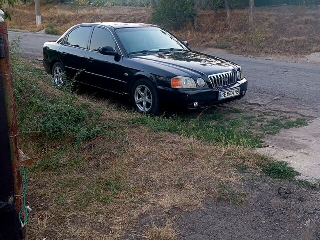 Черный Киа Маджентис, объемом двигателя 2 л и пробегом 268 тыс. км за 3100 $, фото 1 на Automoto.ua