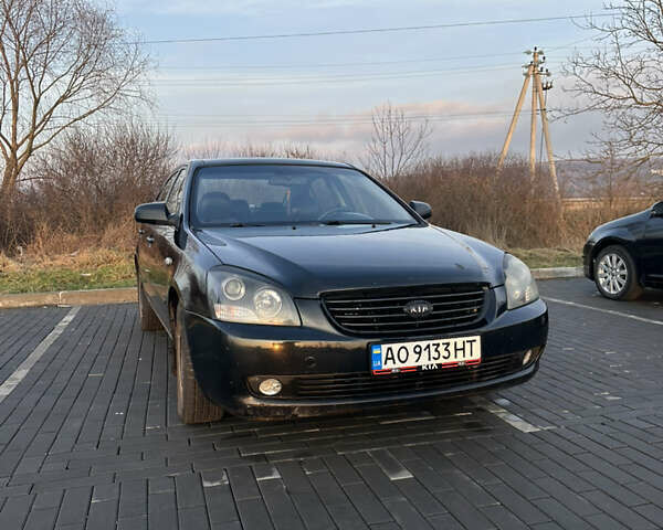 Черный Киа Маджентис, объемом двигателя 2 л и пробегом 355 тыс. км за 5600 $, фото 1 на Automoto.ua