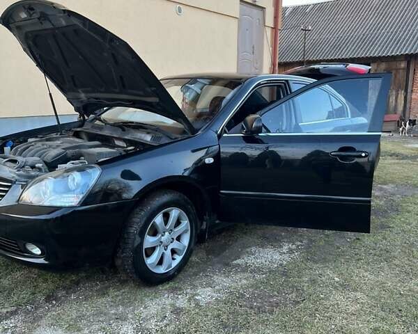 Чорний Кіа Маджентіс, об'ємом двигуна 2 л та пробігом 200 тис. км за 4650 $, фото 1 на Automoto.ua