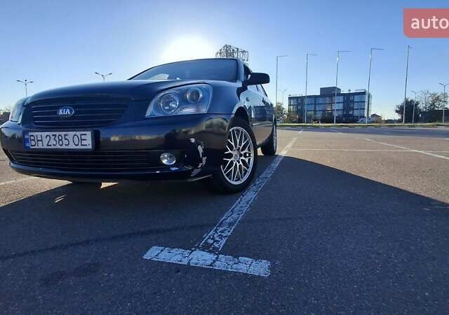 Чорний Кіа Маджентіс, об'ємом двигуна 2 л та пробігом 373 тис. км за 4500 $, фото 1 на Automoto.ua