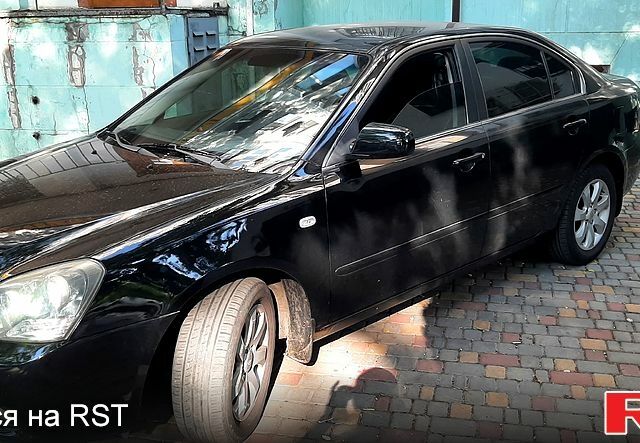 Чорний Кіа Маджентіс, об'ємом двигуна 2 л та пробігом 215 тис. км за 5750 $, фото 1 на Automoto.ua