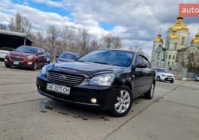 Чорний Кіа Маджентіс, об'ємом двигуна 2 л та пробігом 335 тис. км за 6500 $, фото 1 на Automoto.ua