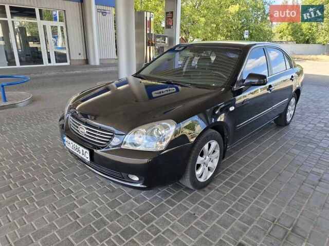 Чорний Кіа Маджентіс, об'ємом двигуна 2 л та пробігом 192 тис. км за 6600 $, фото 1 на Automoto.ua