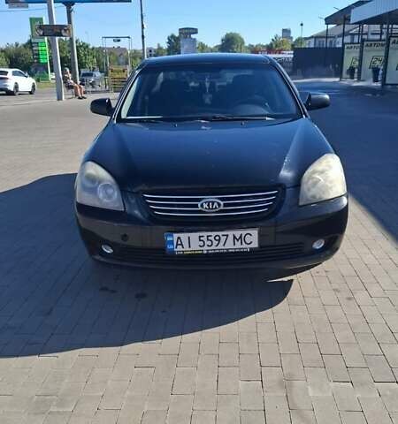 Чорний Кіа Маджентіс, об'ємом двигуна 2 л та пробігом 264 тис. км за 4500 $, фото 1 на Automoto.ua
