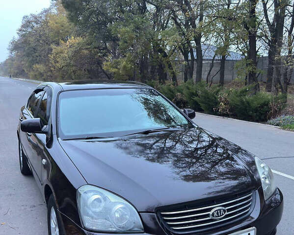 Коричневый Киа Маджентис, объемом двигателя 2 л и пробегом 225 тыс. км за 5500 $, фото 1 на Automoto.ua