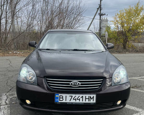 Коричневий Кіа Маджентіс, об'ємом двигуна 2 л та пробігом 170 тис. км за 6808 $, фото 1 на Automoto.ua