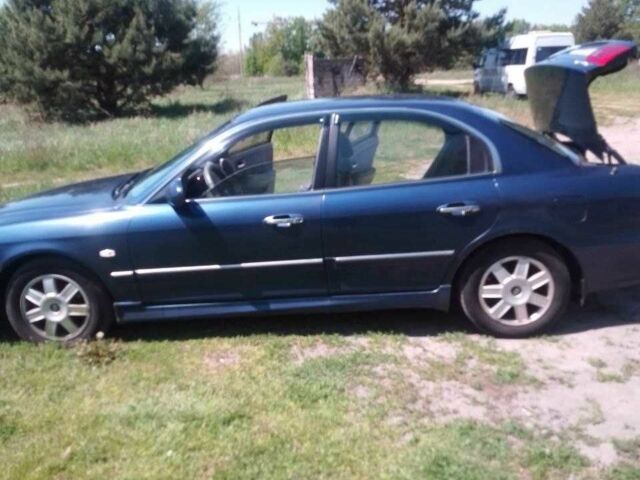 Синій Кіа Маджентіс, об'ємом двигуна 2 л та пробігом 316 тис. км за 3300 $, фото 1 на Automoto.ua