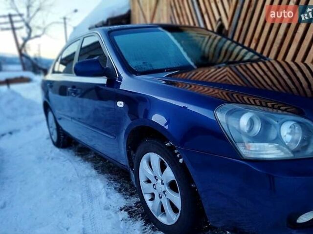 Синій Кіа Маджентіс, об'ємом двигуна 2 л та пробігом 318 тис. км за 4400 $, фото 1 на Automoto.ua