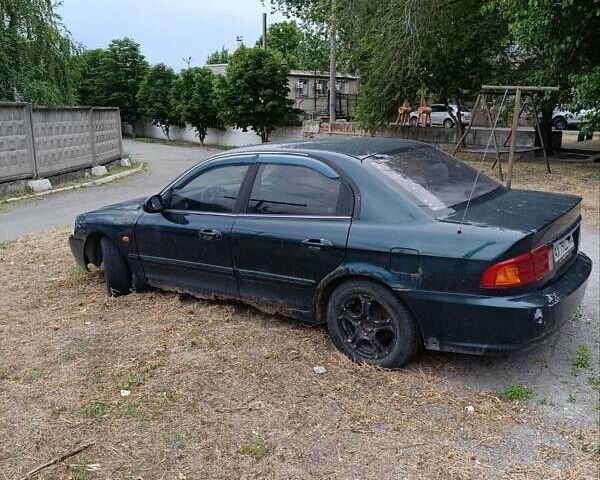 Зеленый Киа Маджентис, объемом двигателя 2 л и пробегом 350 тыс. км за 2000 $, фото 1 на Automoto.ua