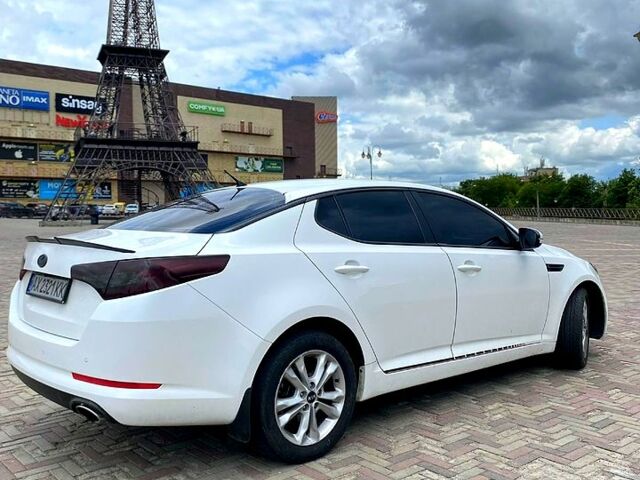 Білий Кіа Оптіма, об'ємом двигуна 2 л та пробігом 25600 тис. км за 9700 $, фото 1 на Automoto.ua