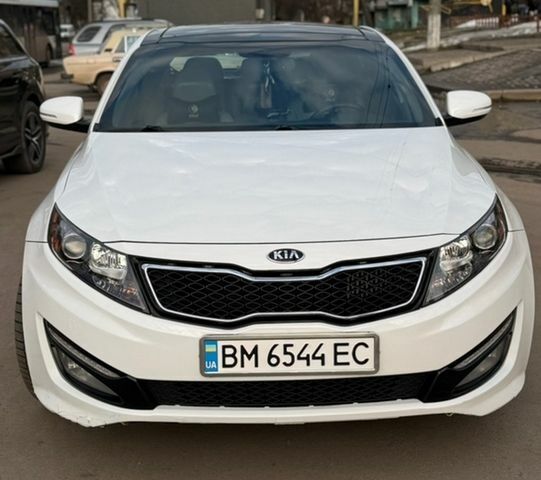 Белый Киа Оптима, объемом двигателя 2 л и пробегом 230 тыс. км за 9099 $, фото 1 на Automoto.ua