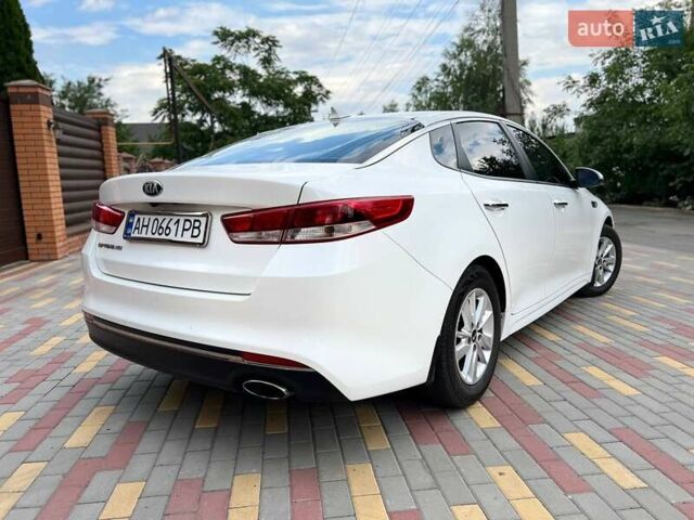 Белый Киа Оптима, объемом двигателя 2.36 л и пробегом 118 тыс. км за 10700 $, фото 1 на Automoto.ua