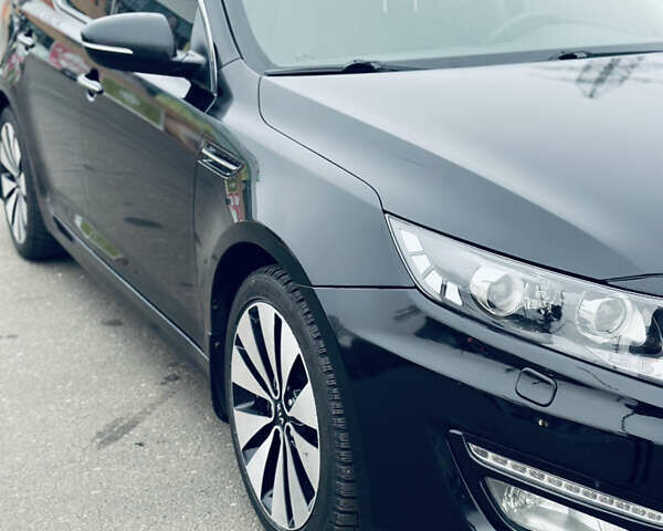 Черный Киа Оптима, объемом двигателя 2.36 л и пробегом 210 тыс. км за 9900 $, фото 1 на Automoto.ua