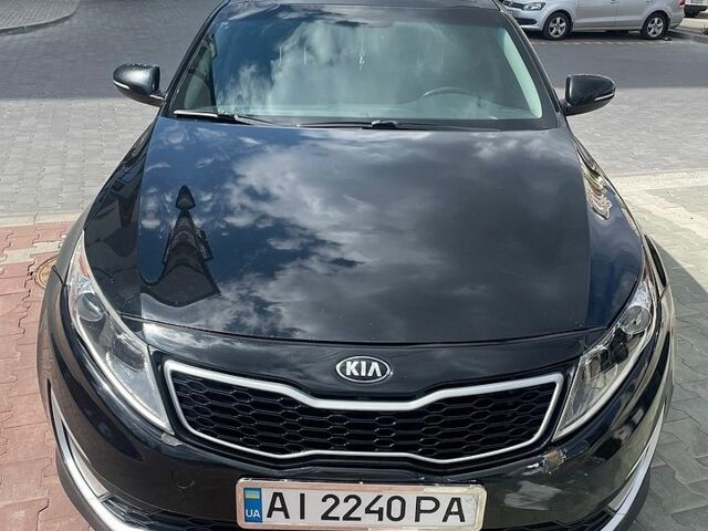 Черный Киа Оптима, объемом двигателя 2.4 л и пробегом 112 тыс. км за 10300 $, фото 1 на Automoto.ua
