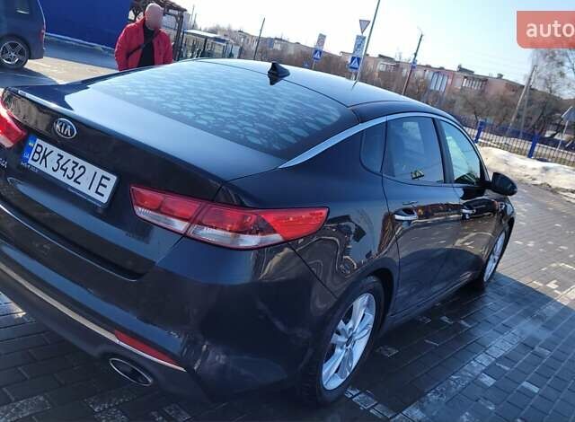 Черный Киа Оптима, объемом двигателя 2.5 л и пробегом 248 тыс. км за 12000 $, фото 1 на Automoto.ua