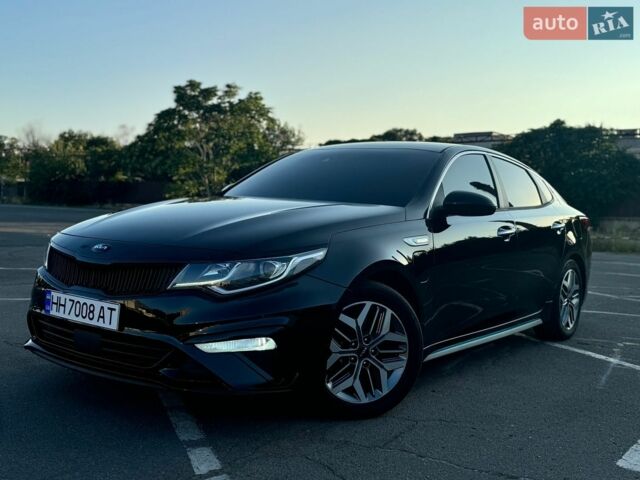 Чорний Кіа Оптіма, об'ємом двигуна 2 л та пробігом 82 тис. км за 18900 $, фото 1 на Automoto.ua