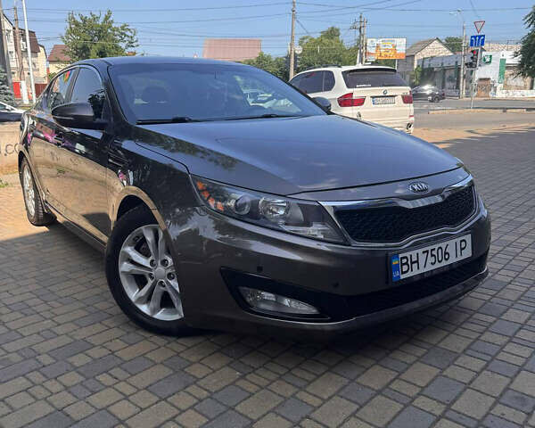 Коричневий Кіа Оптіма, об'ємом двигуна 2.4 л та пробігом 210 тис. км за 8500 $, фото 1 на Automoto.ua