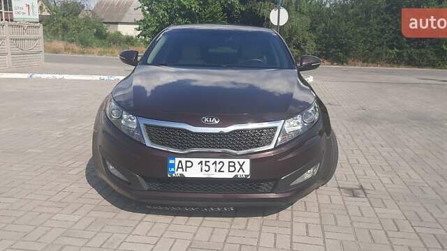 Красный Киа Оптима, объемом двигателя 2.4 л и пробегом 113 тыс. км за 10000 $, фото 1 на Automoto.ua