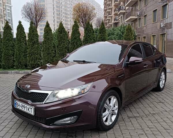 Красный Киа Оптима, объемом двигателя 2.36 л и пробегом 164 тыс. км за 10100 $, фото 1 на Automoto.ua