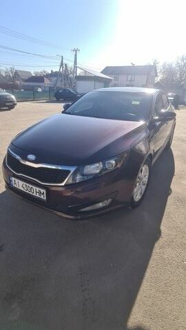 Красный Киа Оптима, объемом двигателя 2.36 л и пробегом 230 тыс. км за 10000 $, фото 1 на Automoto.ua