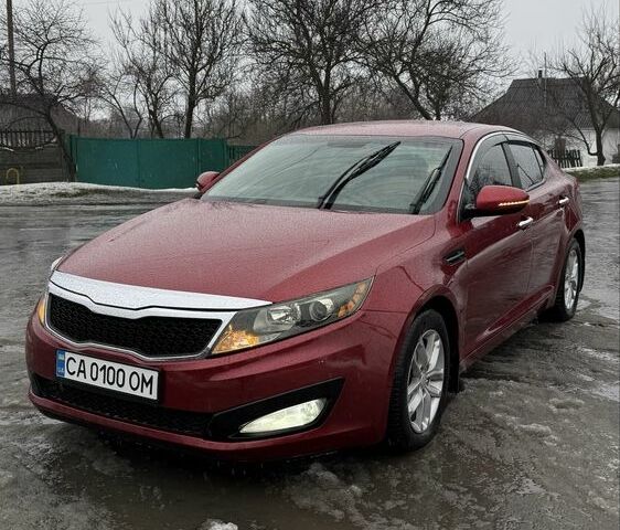 Красный Киа Оптима, объемом двигателя 2.4 л и пробегом 125 тыс. км за 7200 $, фото 1 на Automoto.ua