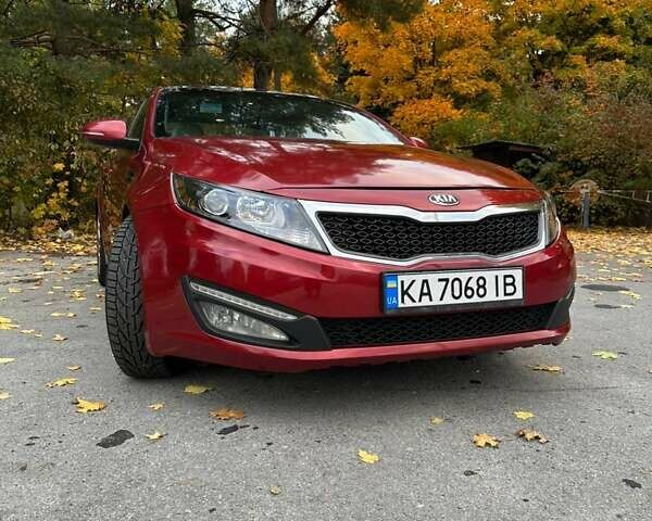 Красный Киа Оптима, объемом двигателя 2 л и пробегом 195 тыс. км за 9700 $, фото 1 на Automoto.ua