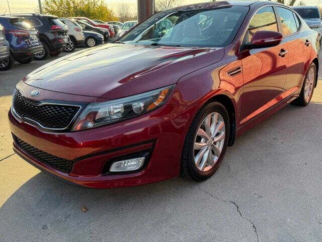 Красный Киа Оптима, объемом двигателя 2.4 л и пробегом 83 тыс. км за 5000 $, фото 1 на Automoto.ua