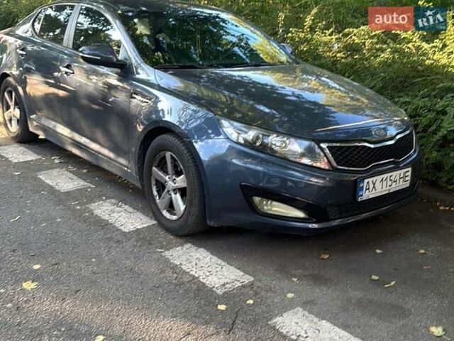 Синий Киа Оптима, объемом двигателя 2.36 л и пробегом 240 тыс. км за 4000 $, фото 1 на Automoto.ua