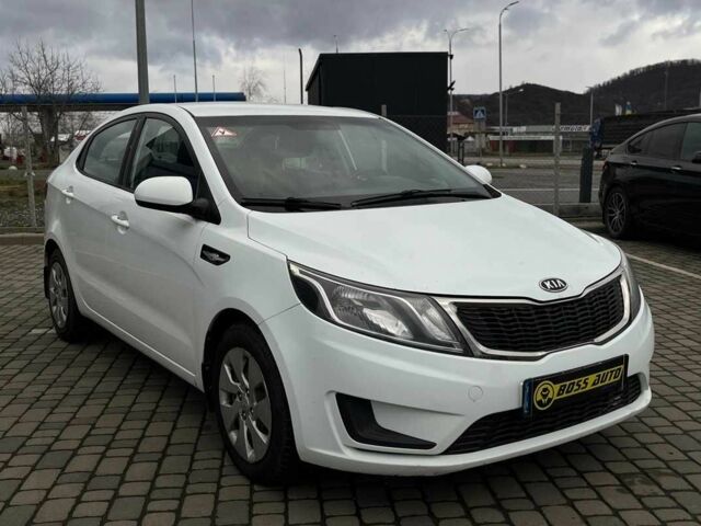 Білий Кіа Ріо, об'ємом двигуна 1.4 л та пробігом 200 тис. км за 6900 $, фото 1 на Automoto.ua