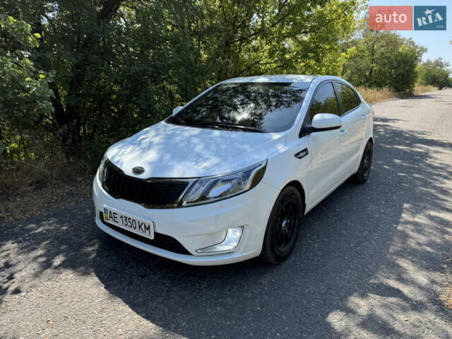 Білий Кіа Ріо, об'ємом двигуна 1.4 л та пробігом 96 тис. км за 8555 $, фото 1 на Automoto.ua