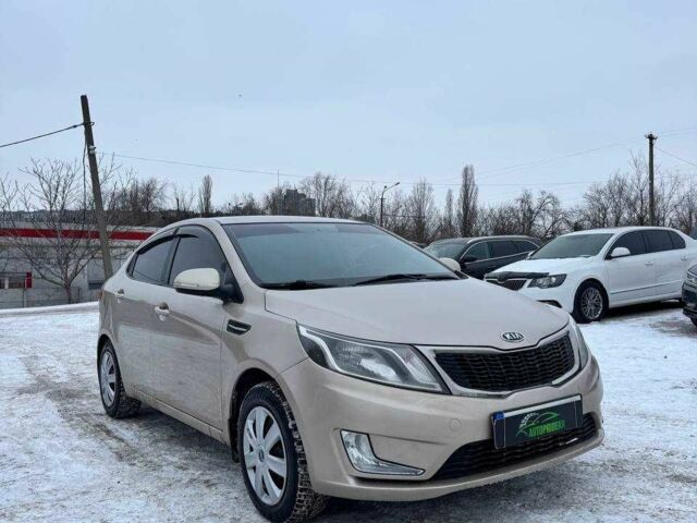 Бежевий Кіа Ріо, об'ємом двигуна 1.6 л та пробігом 162 тис. км за 5999 $, фото 1 на Automoto.ua