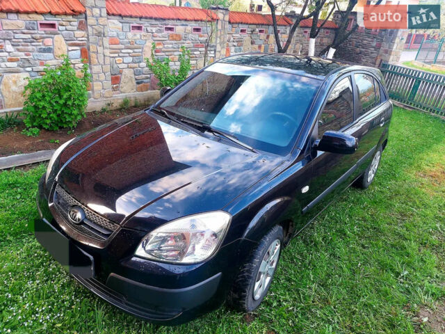 Чорний Кіа Ріо, об'ємом двигуна 1.4 л та пробігом 290 тис. км за 4600 $, фото 1 на Automoto.ua
