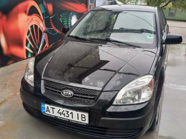 Чорний Кіа Ріо, об'ємом двигуна 1.4 л та пробігом 230 тис. км за 5248 $, фото 1 на Automoto.ua