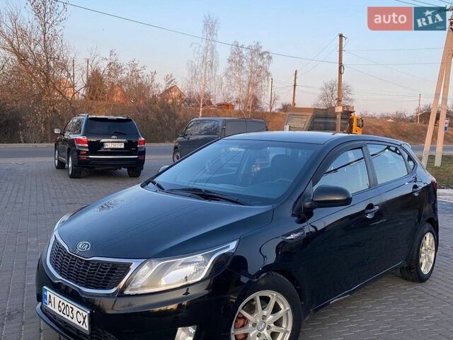 Черный Киа Рио, объемом двигателя 1.4 л и пробегом 170 тыс. км за 6700 $, фото 1 на Automoto.ua