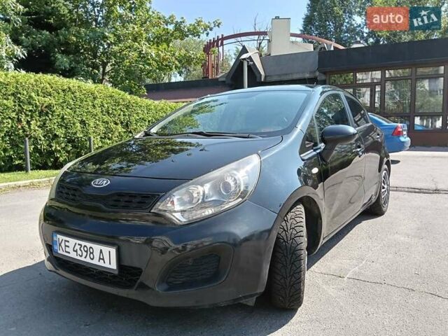 Черный Киа Рио, объемом двигателя 1.25 л и пробегом 252 тыс. км за 5999 $, фото 1 на Automoto.ua