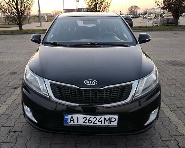 Черный Киа Рио, объемом двигателя 1.59 л и пробегом 137 тыс. км за 7750 $, фото 1 на Automoto.ua